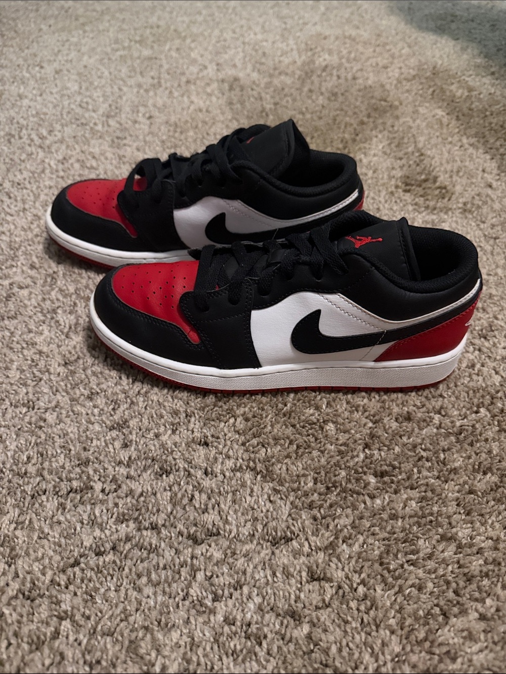 Nike Air Jordan’s Low-Top Sneakers in Black, Red & White